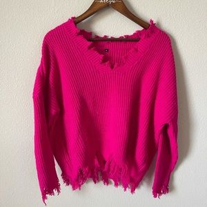 Hot pink sweater with frayed edges